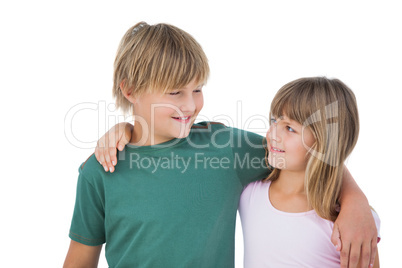 Little boy and girl looking each other and smiling