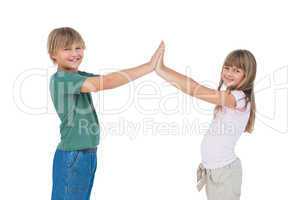 Smiling boy and girl high fiving