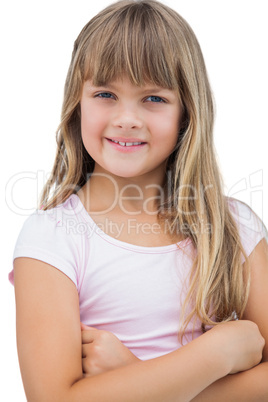 Beautiful little girl smiling with her arms crossed