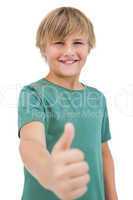 Happy little boy giving thumbs up