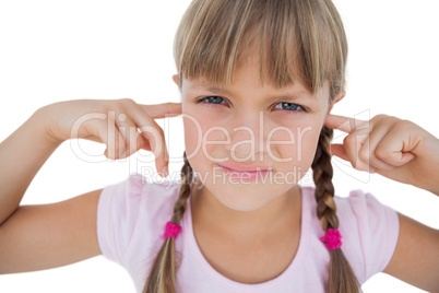Little girl clogging her ears