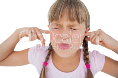 Little girl clogging her ears
