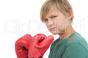 Furious boy with boxing gloves