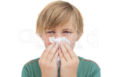 Sick little boy with a handkerchief