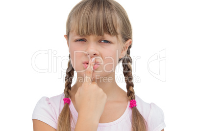 Young girl with her finger on her mouth