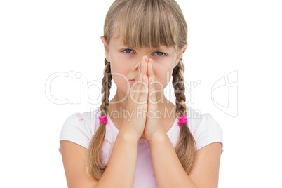 Little girl with her hands on her face