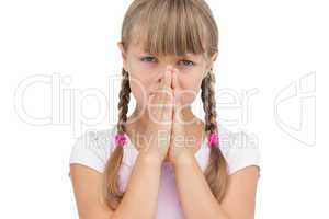 Little girl with her hands on her face