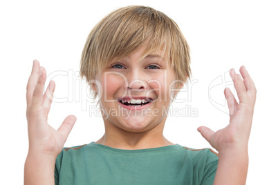 Suprised blonde boy with hands up