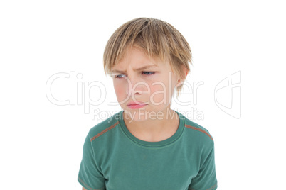 Furious little boy looking down