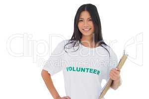 Attractive woman wearing volunteer tshirt holding clipboard