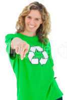 Smiling environmental activist wearing green shirt with recyclin