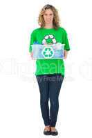 Cheerful environmental activist holding recycling box