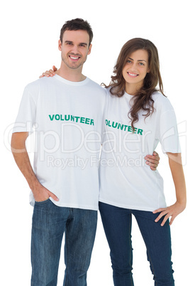 Two cheerful people wearing volunteer tshirt