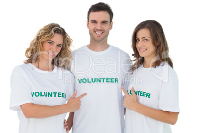 Group of volunteers pointing their tshirt