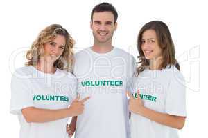 Group of volunteers pointing their tshirt