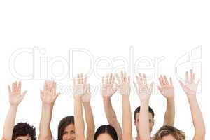 Group of people raising arms