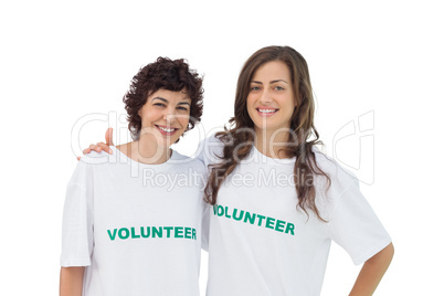 Two cheerful volunteers standing