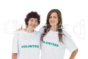 Two cheerful volunteers standing