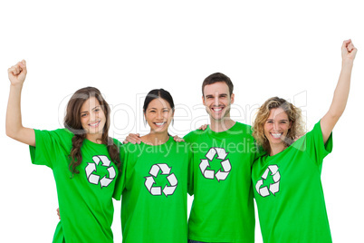 Smiling group of environmental activists raising arms