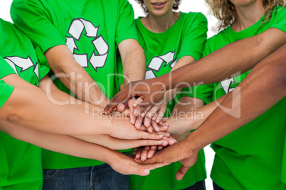 Group of environmental activists putting hands together