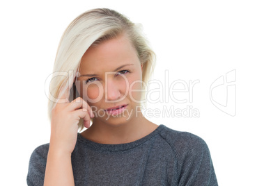 Blonde woman suffering with headache