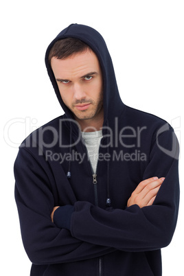 Attractive man with arms crossed looking angry