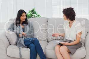 Woman listening to her therapist