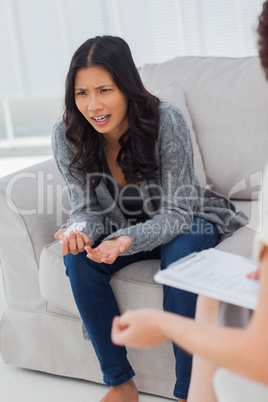 Crying woman speaking to her therapist