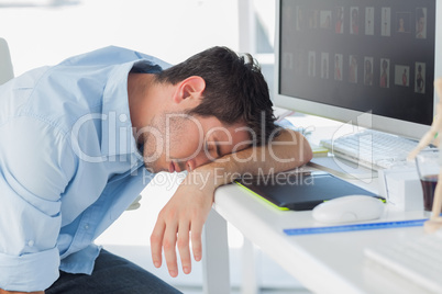 Graphic designer sleeping on the keyboard