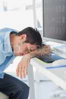 Graphic designer sleeping on his keyboard