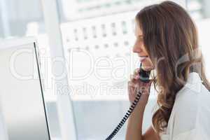 Attractive businesswoman having a phone conversation