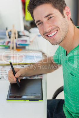 Portrait of a photo editor working on graphics tablet