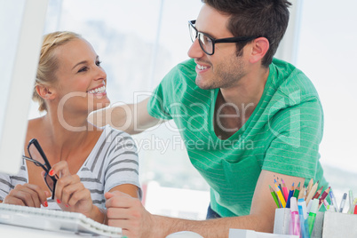Attractive designers working in creative office Attractive designers working in creative office