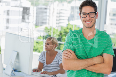 Attractive designer standing in his office