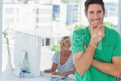 Attractive designer posing in his office