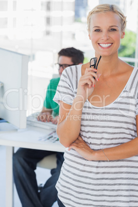 Cheerful designer posing in his office