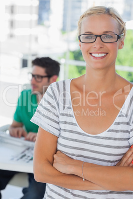 Smiling designer posing in his office