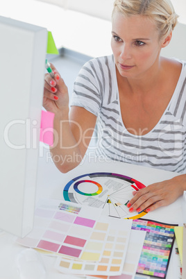 Pretty interior designer working on her computer