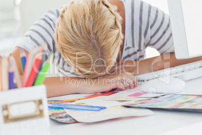 Overworked designer napping on her desk