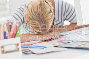 Overworked designer napping on her desk