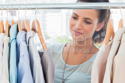 Attractive fashion woman looking at clothes