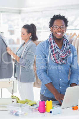 Fashion designer smiling at camera