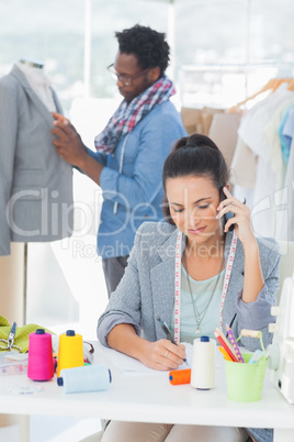 Attractive fashion designer calling