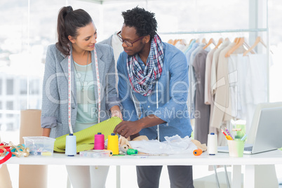 Two fashion designers working together in the office