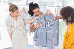 Attractive women looking at blazer