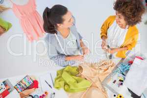 Attractive fashion designers working with textile