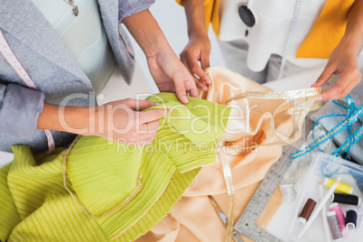Women touching textile