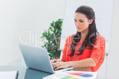 Pretty designer working on her laptop Pretty designer working on her laptop