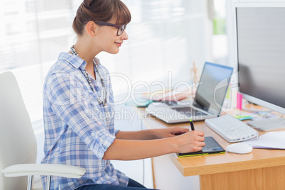 Designer working on her graphics tablet
