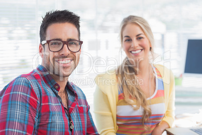 Attractive designers sit in their office